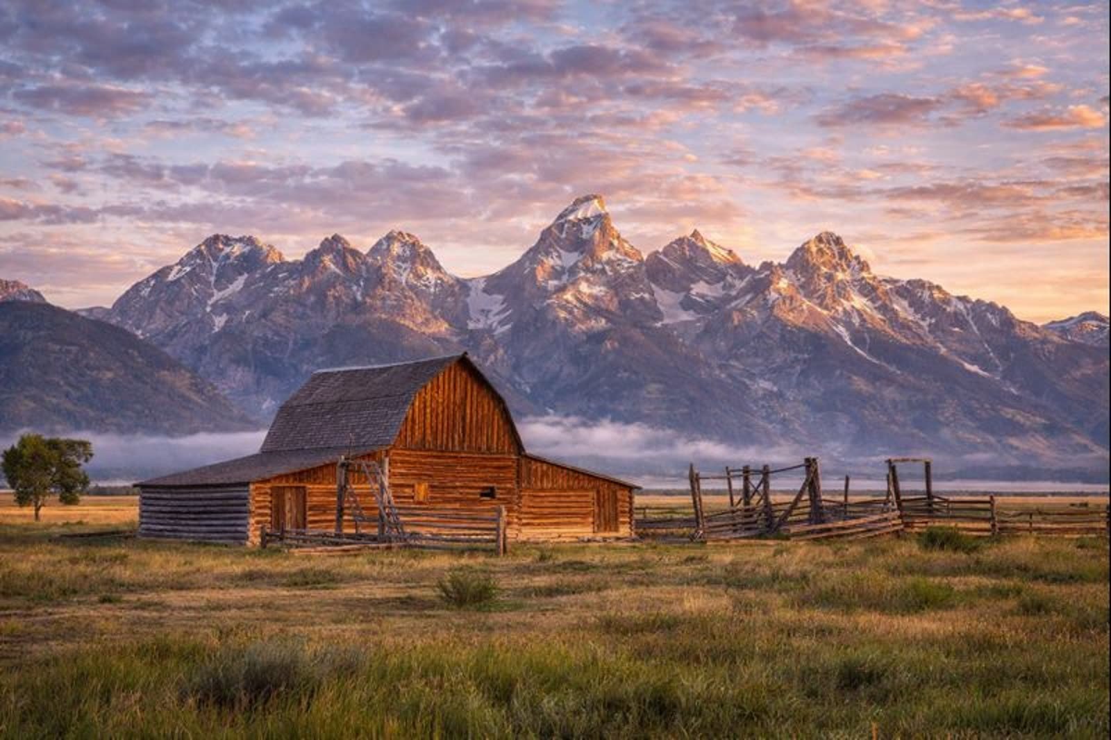 The Tetons behind a historic barn